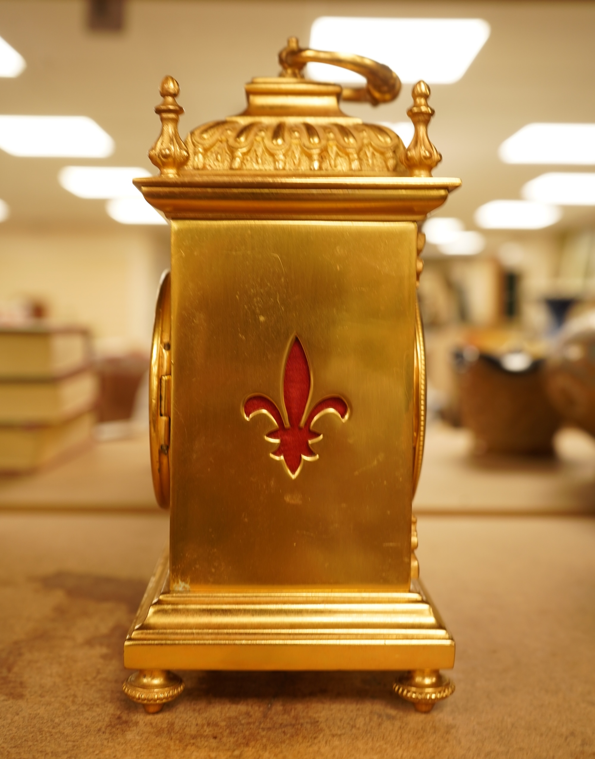 A French gilt brass timepiece with key, 19cm high